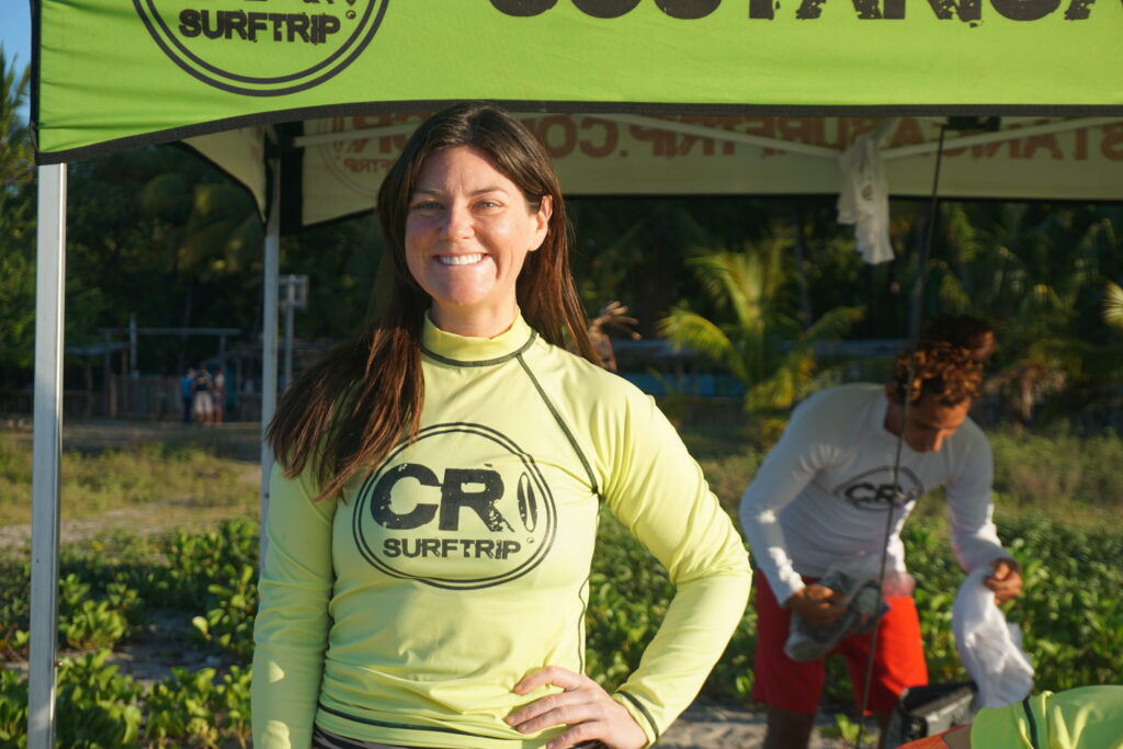 Happy Surfer girl smiles at the camera in Costa Rica