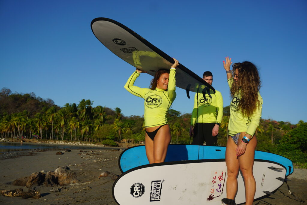 The group gets ready for their surf lesson in Costa Rica during our Surf & Slay vacation package!