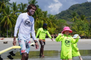 Kids take a Surf Lesson with Costa Rica Surf Trip instructors and director of surf, Jairo Zuniga