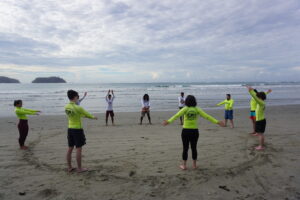 Samara Surf Camp guests get warmed up on the beach with their surf instructors!