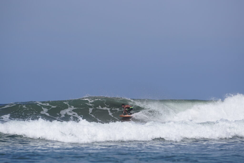 Jairo Zuniga sneaks out of the barrel in Playa Guiones, Nosara