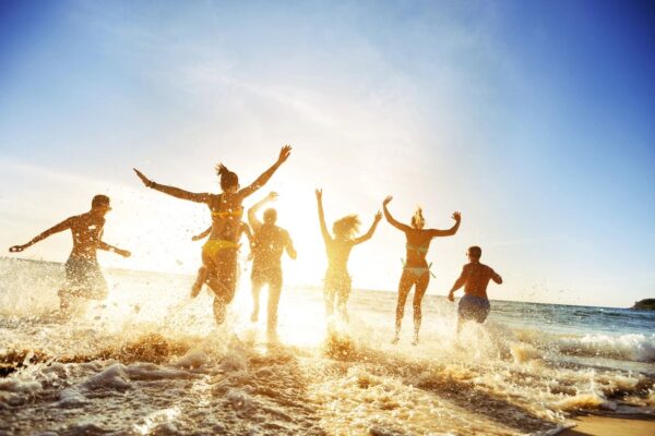 Having fun and jumping in the ocean waves