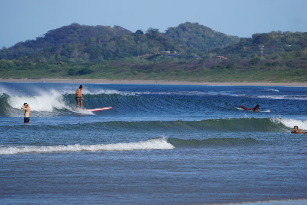 Left handed wave breaks in Playa Tamarindo Costa Rica for intermediate and advanced surfers