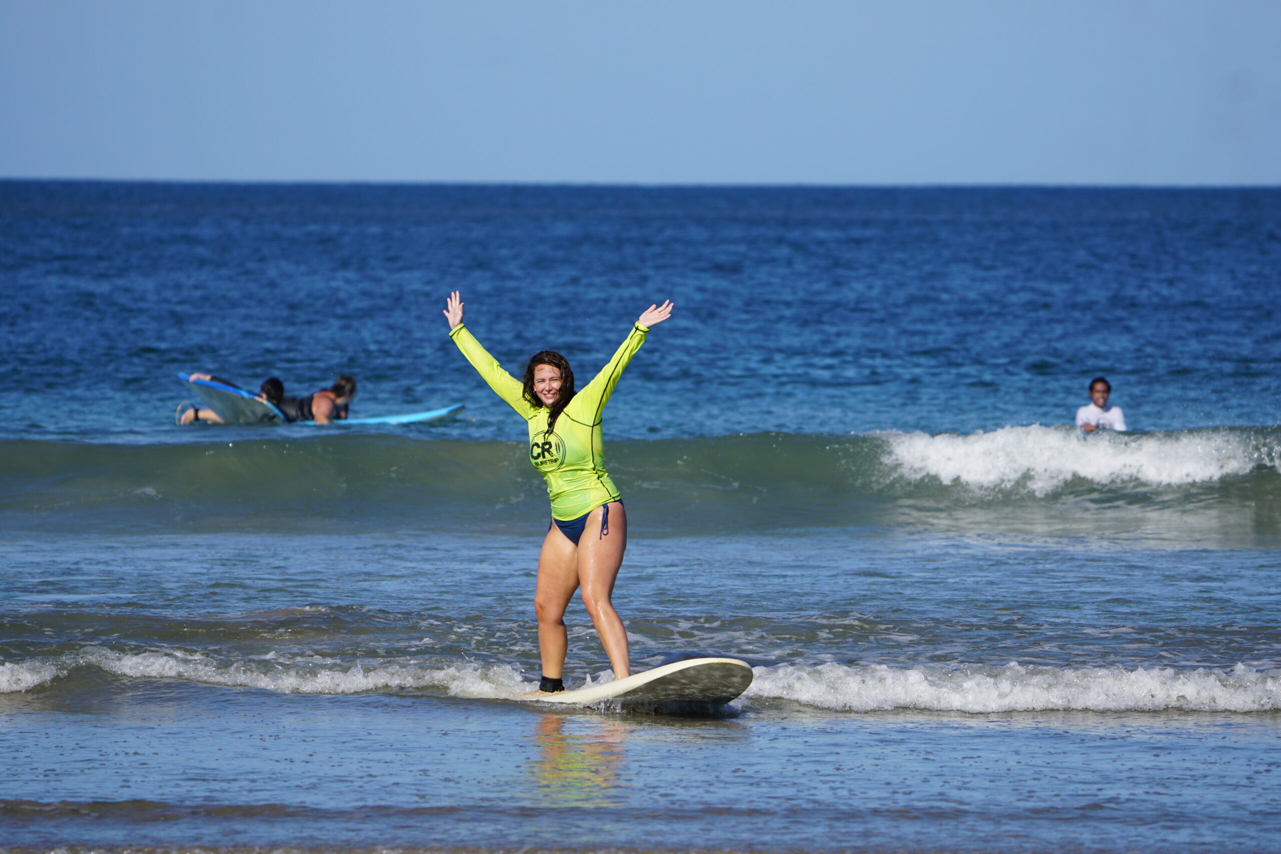 Surf lessons during the surf yoga golf relax vacation package in Tamarindo, Costa Rica