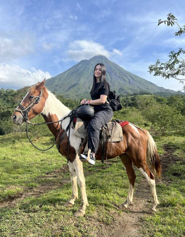 see the arenal volcano on horseback and get a photo on your horse with the volcano on our La Fortuna horseback riding tour