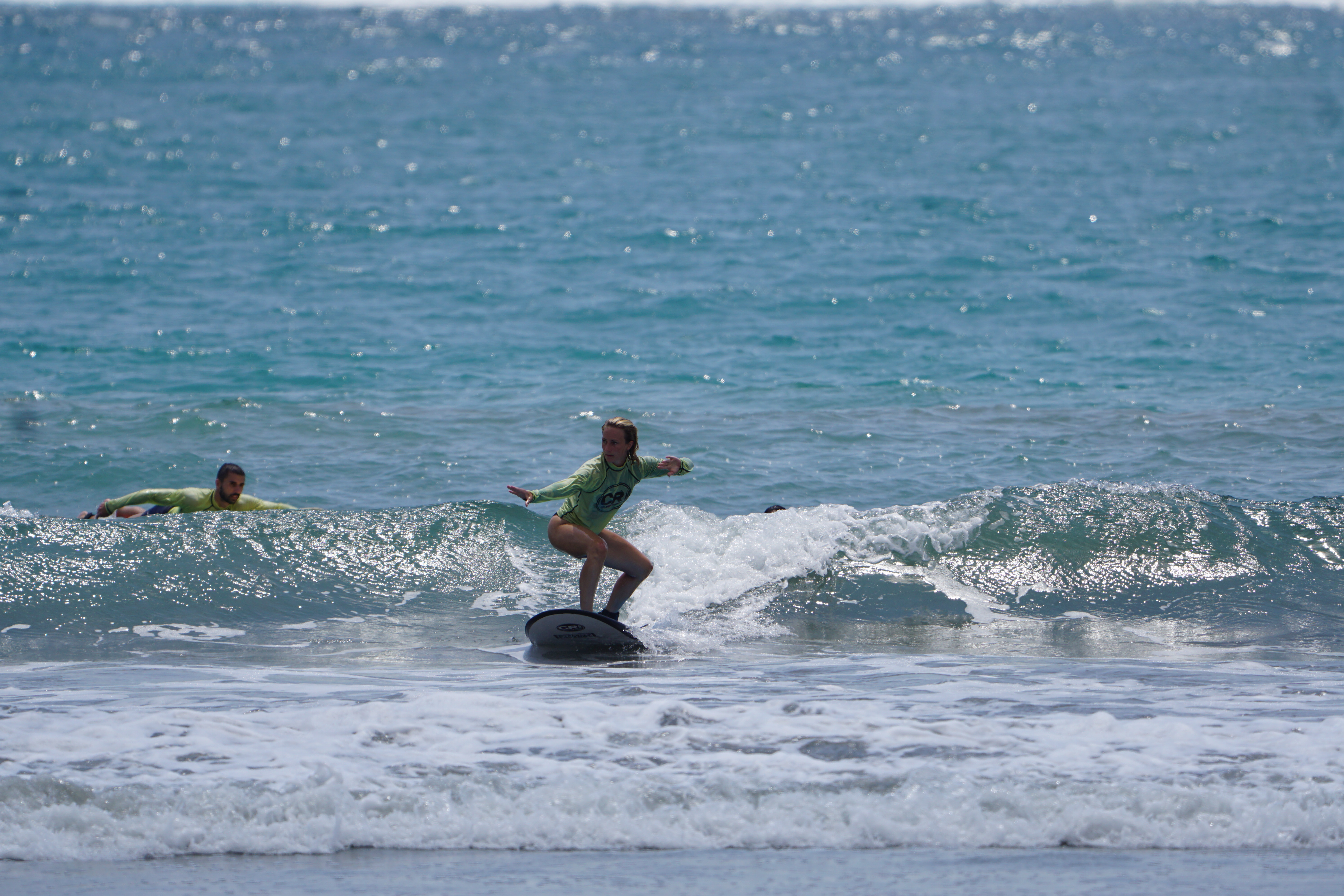 Swann catches a wave at surf camp in playa samara surf lesson