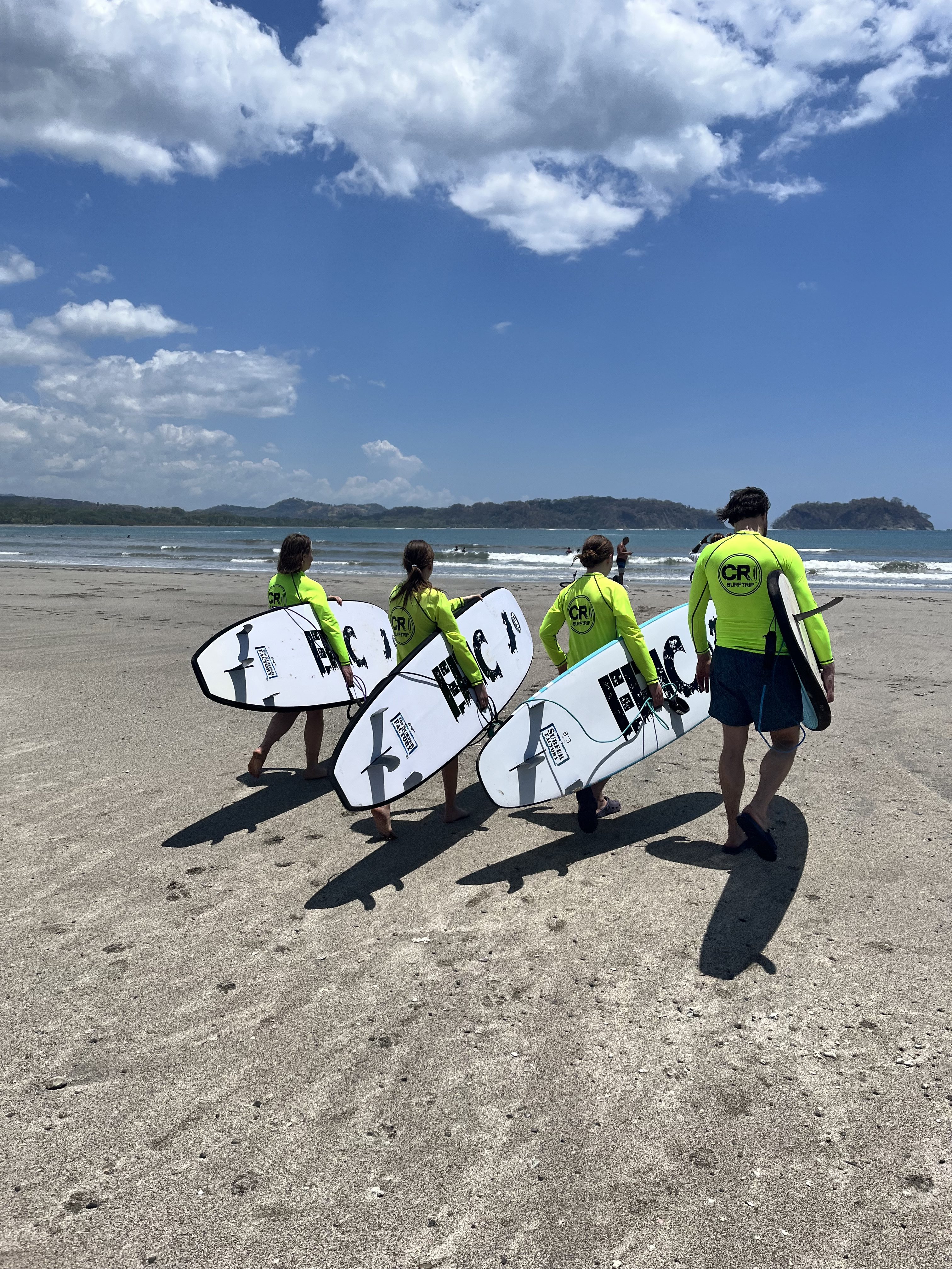 Family takes a surf lesson in Playa samara at samara surf camp
